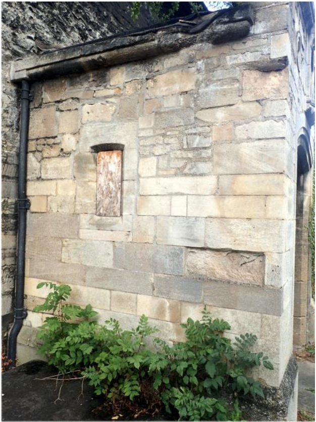 Fig. 6. South Porch west. Rebuilt walling of yellow Ketton, light grey Weldon and dark grey recycled and re-cut Barnack