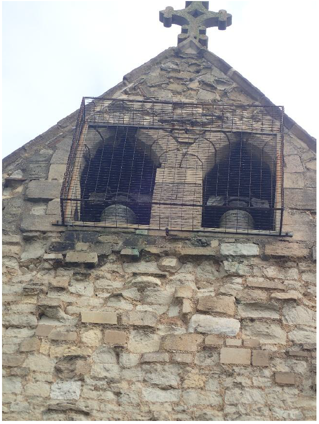 Fig. 9. Bell openings in west gable. Arches and imposts are an even-grained limestone, probably Ketton. The jambs, mullion and sill are a coarse-grained limestone, probably Barnack. Barnack probably reused from former bell tower.