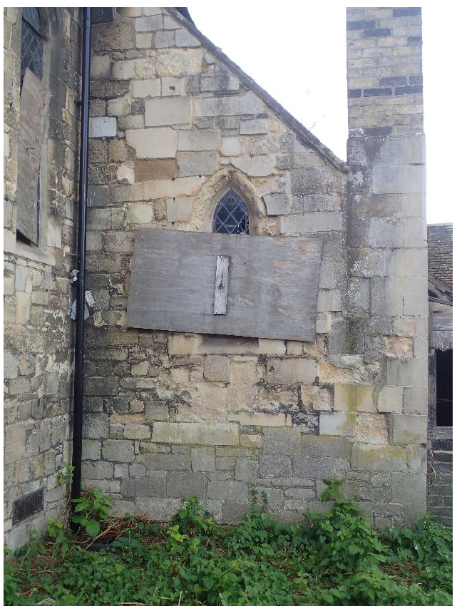 Fig. 15. Vestry/Organ chamber east. Walls of reused coarse grey Barnack, medium-grained yellow Ketton and fine-grained white Clunch. Window of decaying Clunch with Ketton sill.